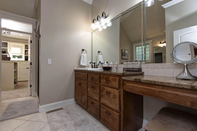 full bath featuring tile patterned floors, a sink, double vanity, baseboards, and visible vents