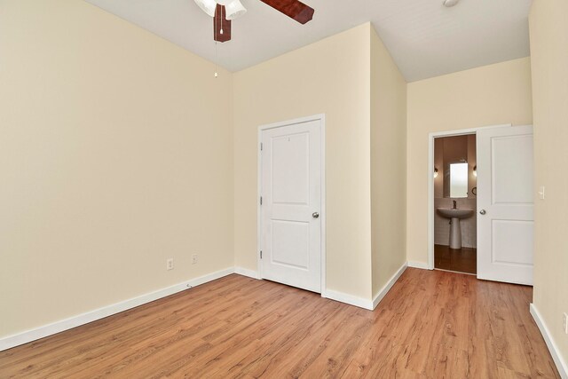 empty room featuring light wood-type flooring and ceiling fan