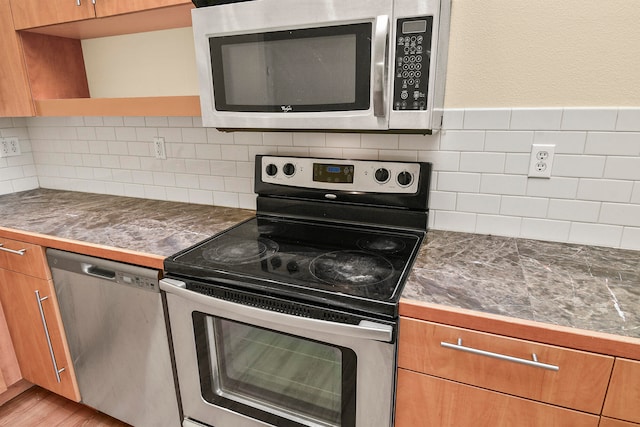 kitchen featuring stainless steel appliances and light wood-type flooring