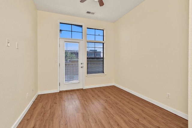 unfurnished room with ceiling fan and light hardwood / wood-style flooring