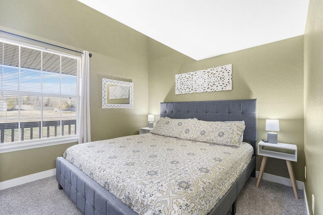 bedroom featuring light colored carpet