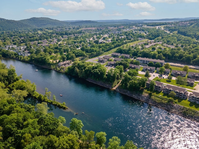 birds eye view of property with a water and mountain view