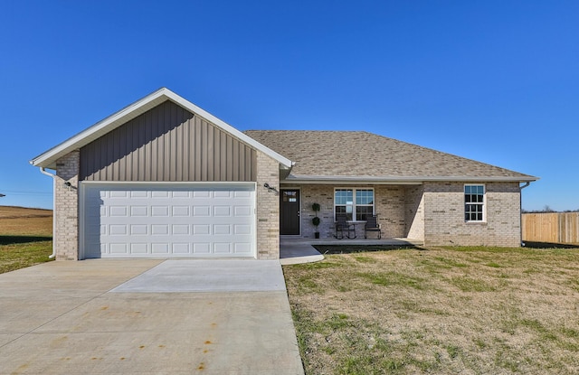 ranch-style home with a front lawn and a garage