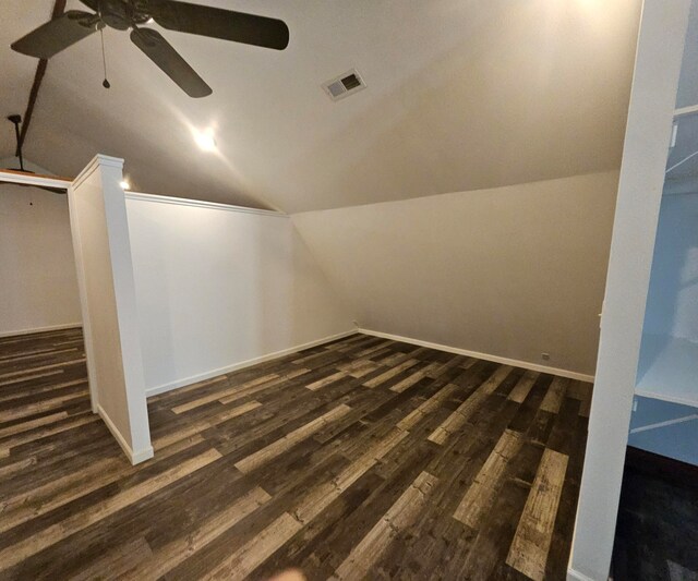 bonus room featuring vaulted ceiling, dark hardwood / wood-style flooring, and ceiling fan