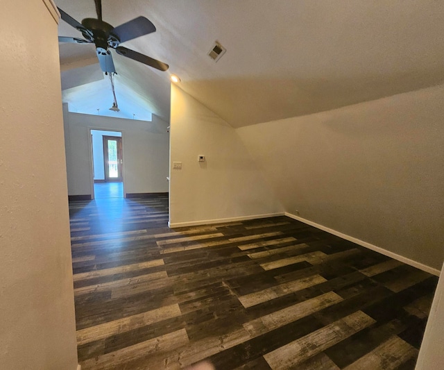 bonus room featuring vaulted ceiling, dark hardwood / wood-style flooring, and ceiling fan