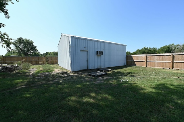 view of outdoor structure with an outbuilding and a fenced backyard