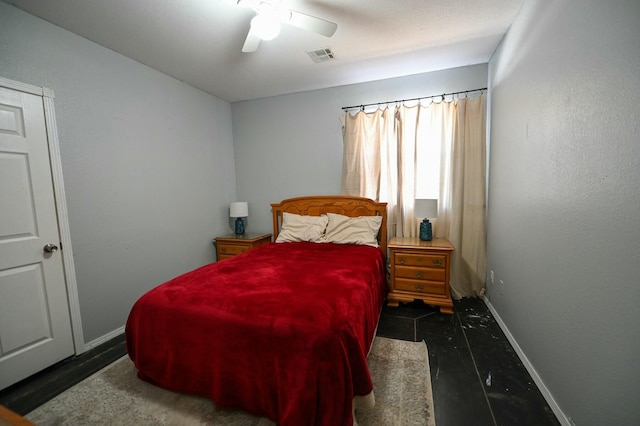 bedroom featuring ceiling fan, visible vents, and baseboards