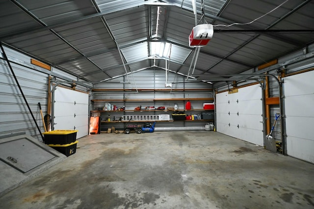 garage with metal wall and a garage door opener