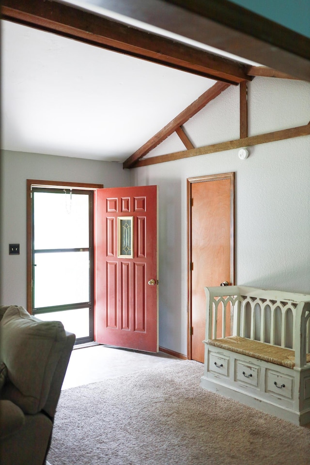 view of carpeted foyer entrance