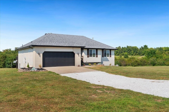 ranch-style home featuring a garage and a front lawn