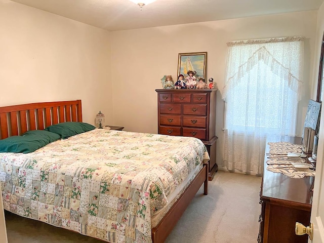 bedroom featuring light colored carpet