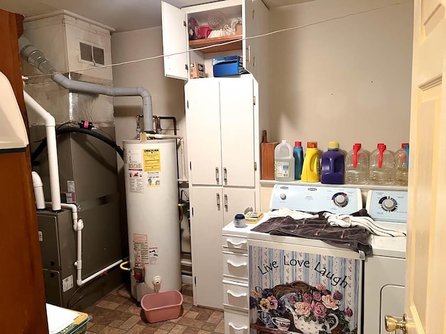 utility room featuring visible vents, water heater, and washer and clothes dryer