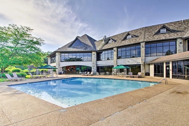 pool featuring a patio area