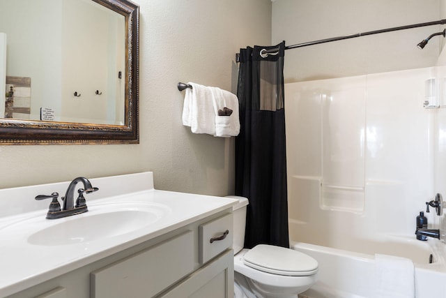 full bathroom featuring shower / tub combo, toilet, and vanity