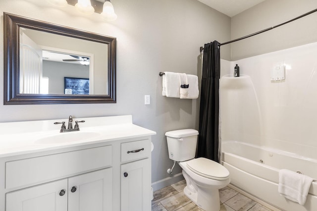 bathroom featuring toilet, baseboards, a ceiling fan, shower / bathtub combination with curtain, and vanity