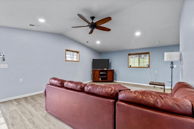 living room with vaulted ceiling, light wood-type flooring, and ceiling fan