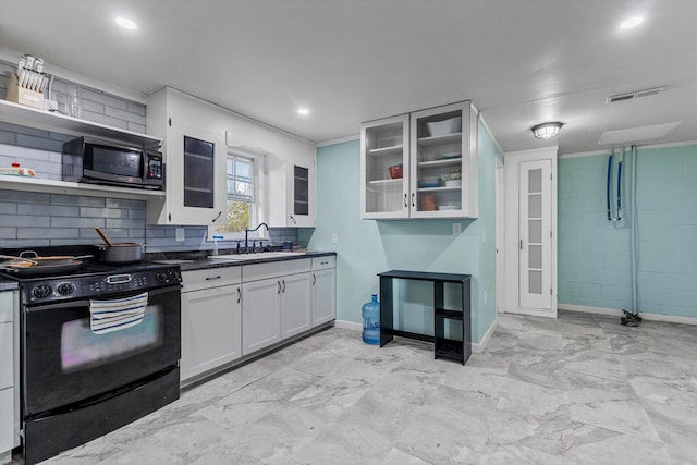 kitchen featuring black appliances, white cabinetry, sink, and tasteful backsplash