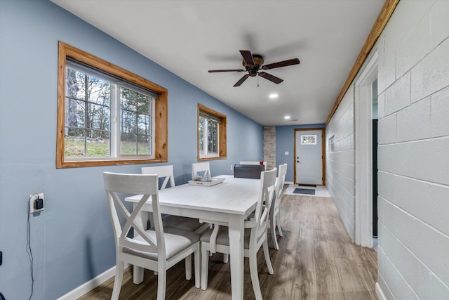 dining room with light wood-type flooring and ceiling fan