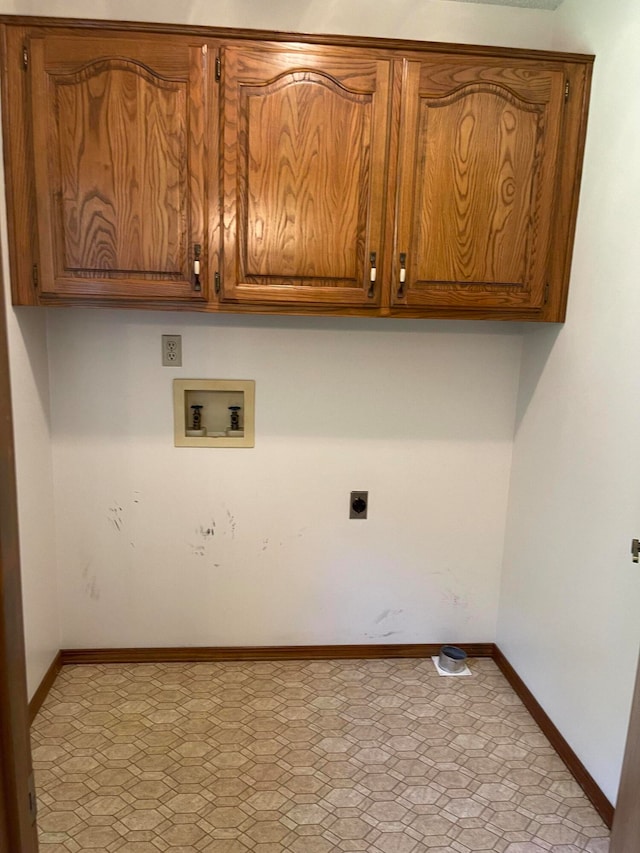 laundry area with hookup for a washing machine, cabinets, and electric dryer hookup