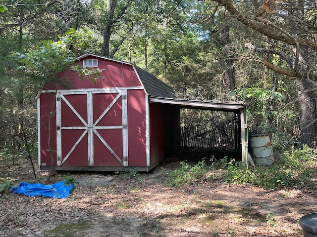 view of outbuilding featuring a carport