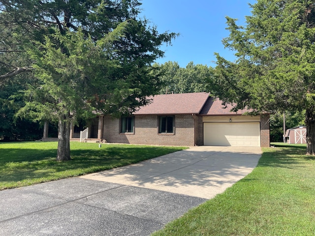 single story home featuring a garage and a front lawn