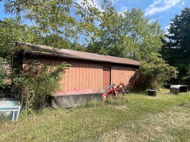 view of outdoor structure with a lawn