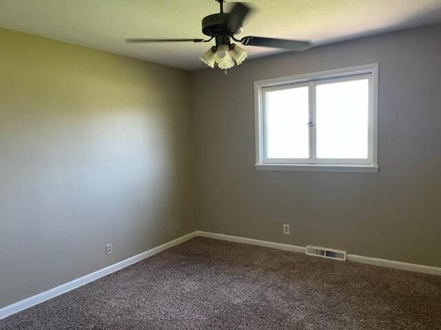 carpeted empty room with ceiling fan