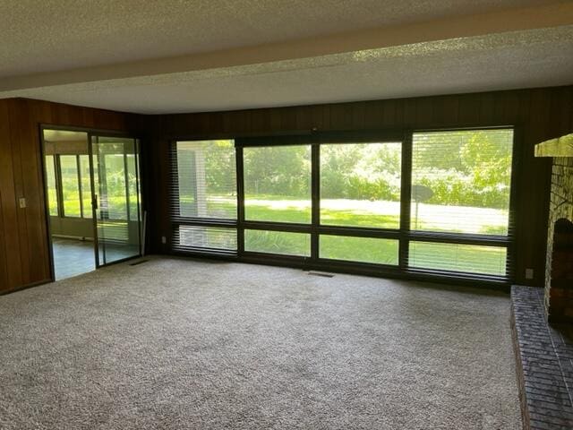 unfurnished sunroom featuring a healthy amount of sunlight