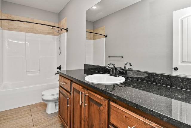 full bathroom with tile patterned flooring, tub / shower combination, vanity, and toilet