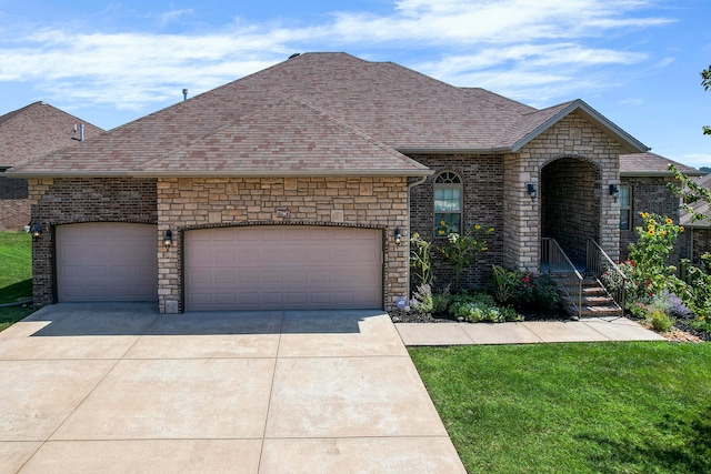 view of front facade with a front lawn and a garage