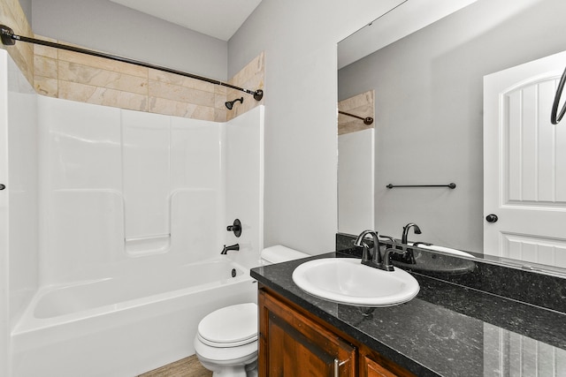 full bathroom featuring wood-type flooring, vanity, toilet, and shower / washtub combination