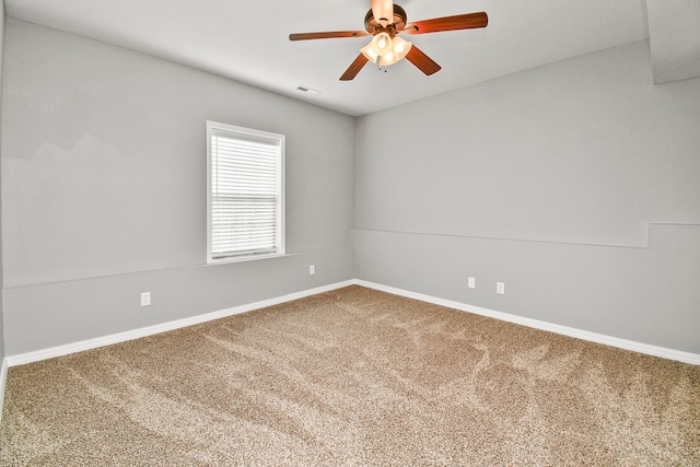 spare room featuring ceiling fan and carpet floors