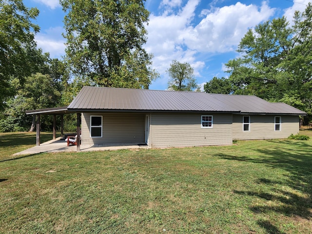 view of property exterior featuring a patio and a yard