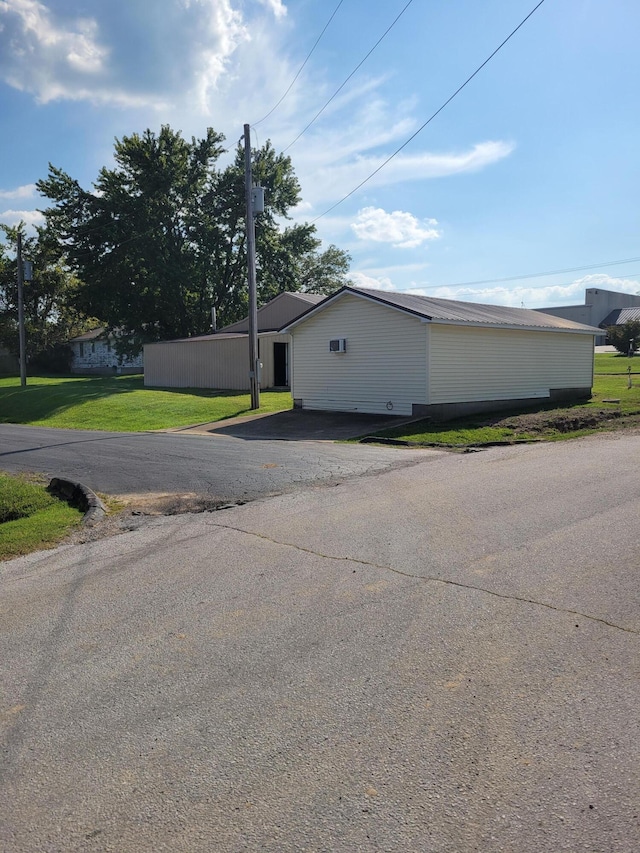 view of side of home featuring a yard