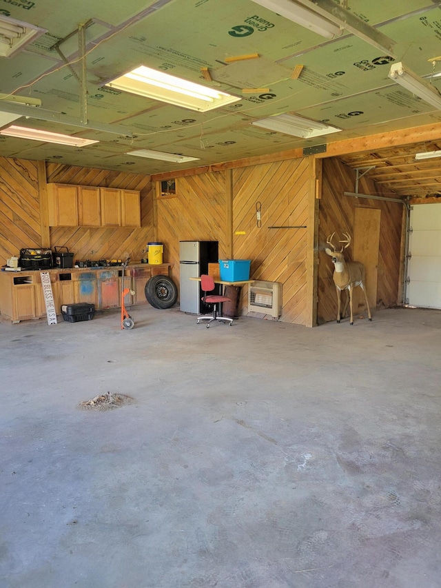 garage featuring wooden walls