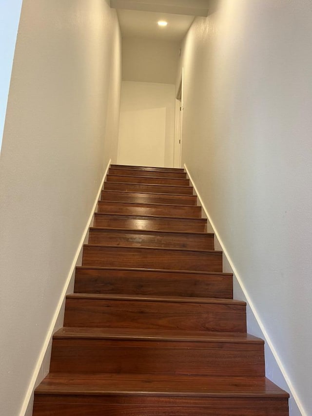 stairway featuring hardwood / wood-style flooring