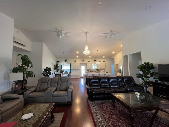 living room featuring lofted ceiling, a wall mounted AC, dark wood-type flooring, and ceiling fan