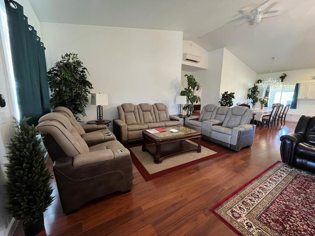 living room with ceiling fan with notable chandelier, vaulted ceiling, dark hardwood / wood-style flooring, and an AC wall unit