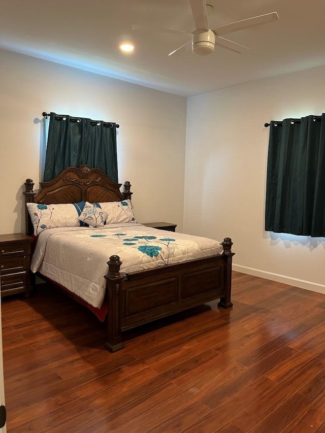 bedroom featuring ceiling fan and dark hardwood / wood-style flooring