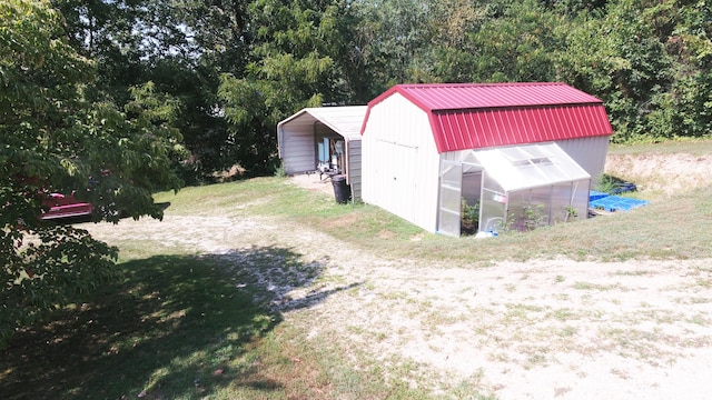 view of outbuilding with a yard