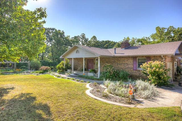 ranch-style house with a front yard and a patio