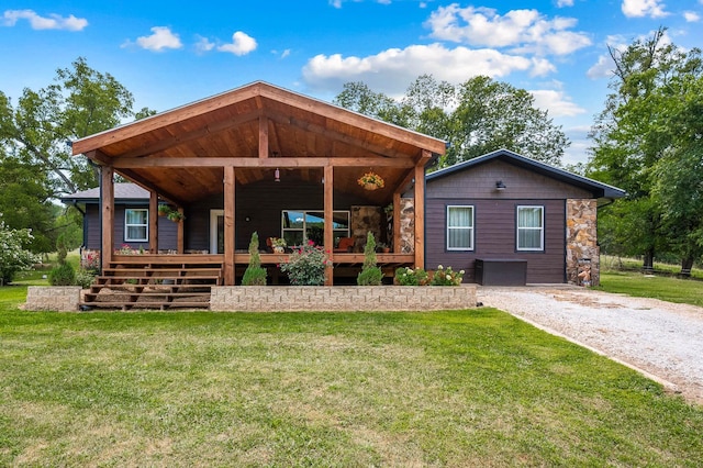 view of front of house featuring a deck and a front lawn