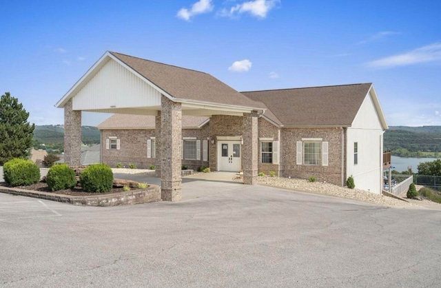 view of front of home with a water view