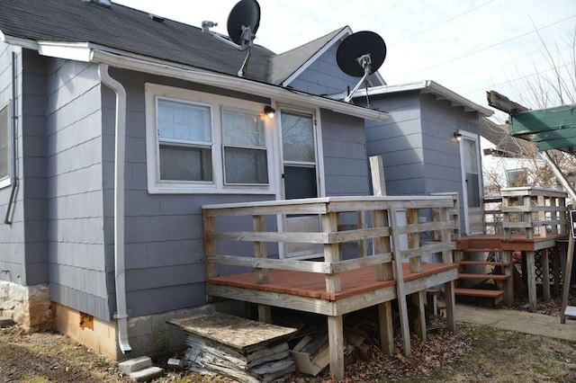 back of house featuring a deck