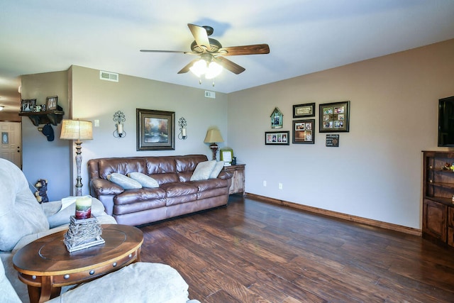 living room with ceiling fan and dark hardwood / wood-style floors