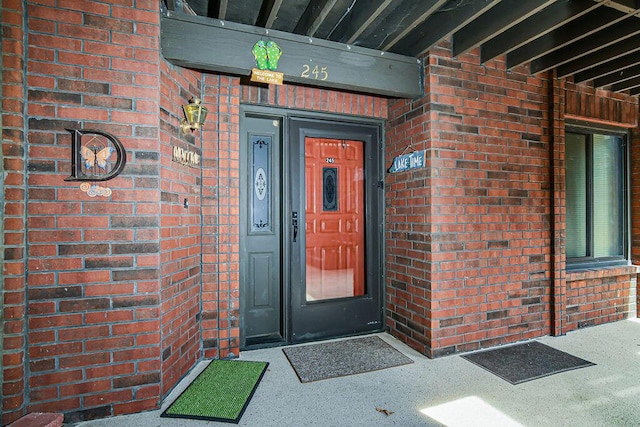 entrance to property with brick siding