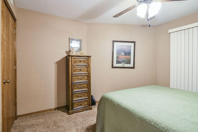 bedroom featuring ceiling fan and light carpet