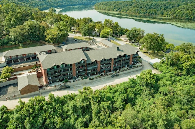 bird's eye view with a forest view and a water view