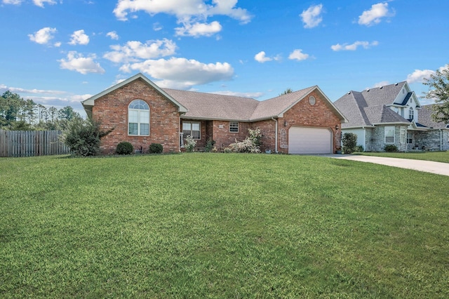 view of front of house with a front yard and a garage