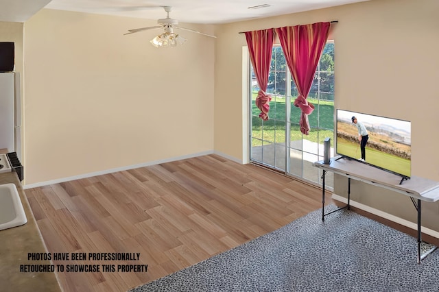 interior space featuring light hardwood / wood-style flooring and ceiling fan